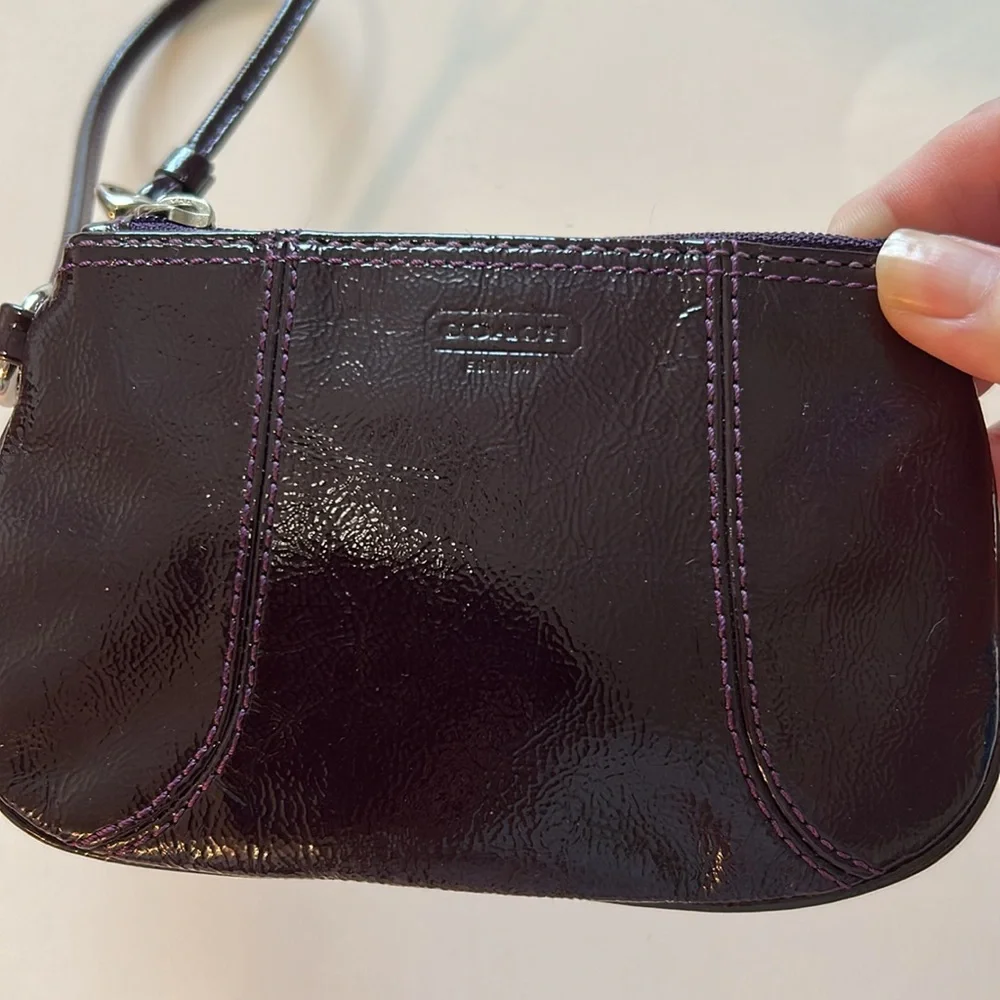 EUC Coach patent leather wristlet in dark purple or plum color and silver metal - Picture 3 of 10